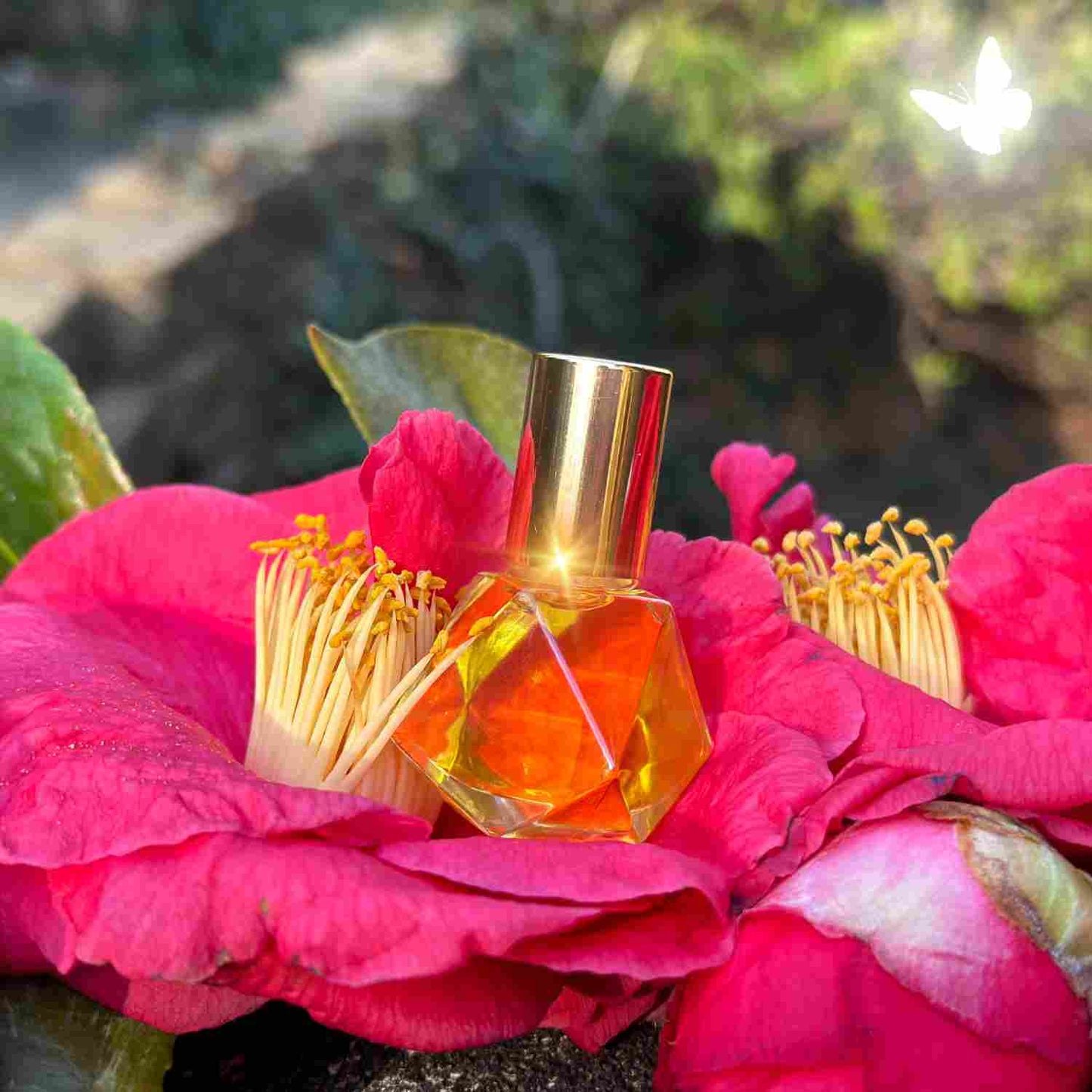 Flora Luxuria 8ml Perfume Oil inside a large camellia blossom